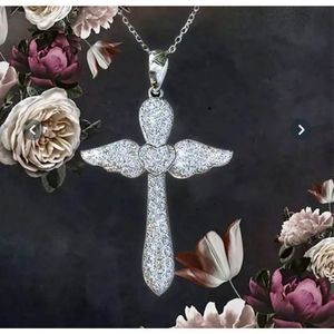 WHITE SAPPHIRE N SILVER WINGED SILVER CROSS NECKLACE